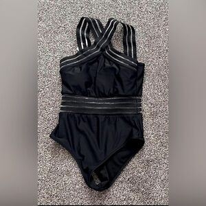 Small black swimsuit with mesh cutouts